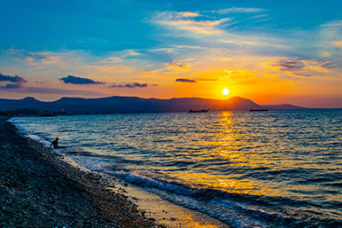 Sunset over Akamas from Polis beach; enjoying residence in Cyprus