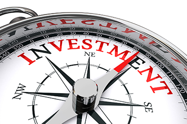Compasses surrounding the word 'Investing': Try to outpace markets