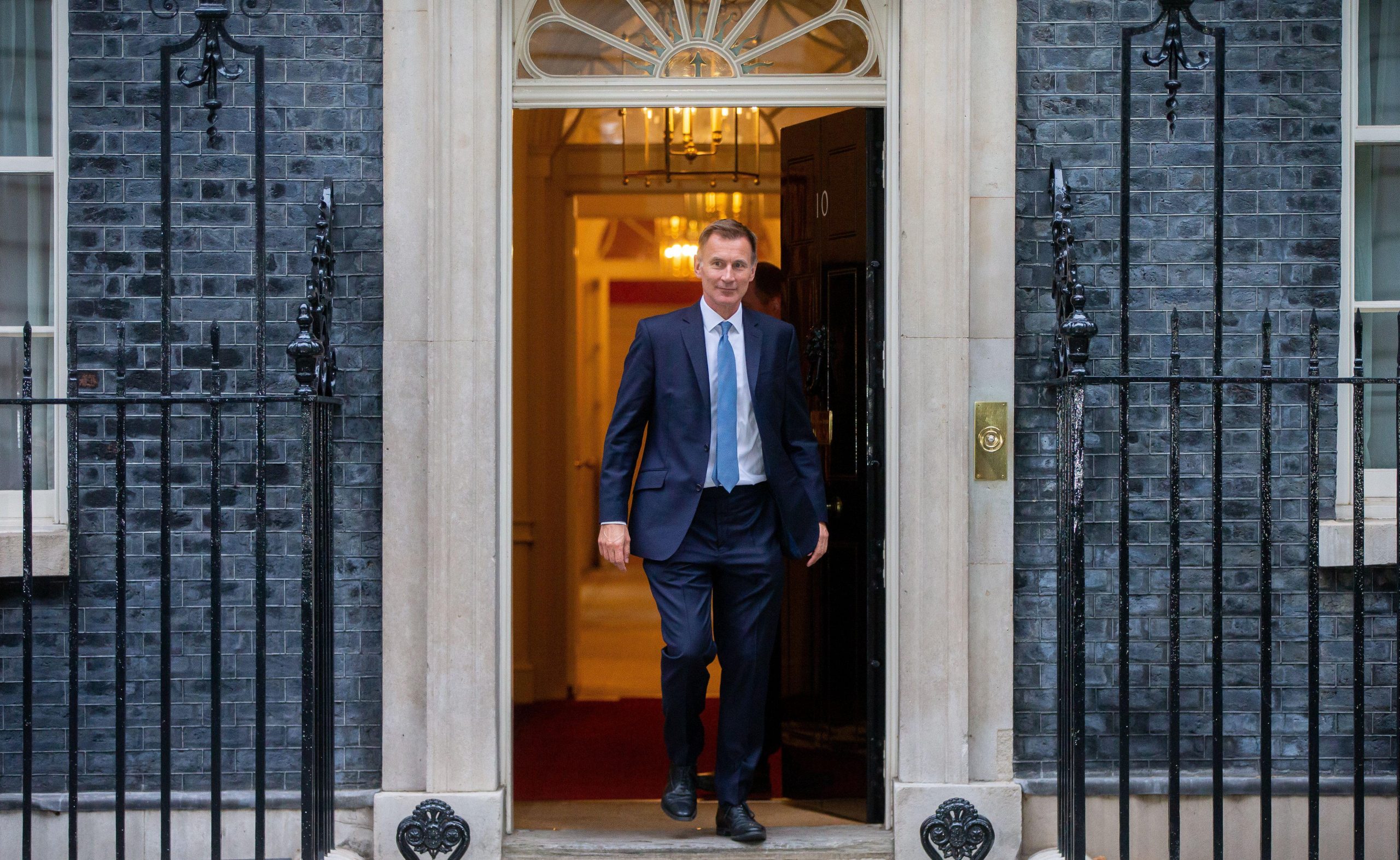Jeremy Hunt leaves Downing Street before budget
