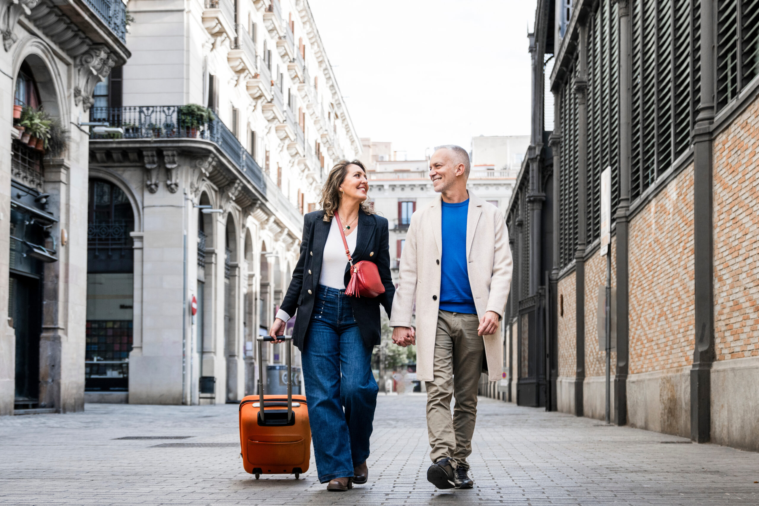 Couple walking down a street in france